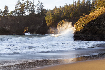 Waves crashing on a rock in Secret Beach, Oregon