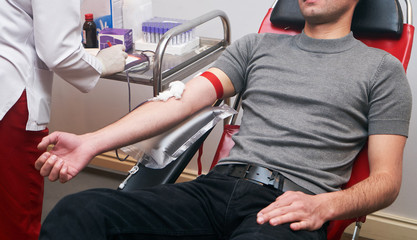 Donating blood in hospital, close-up. Blood donor