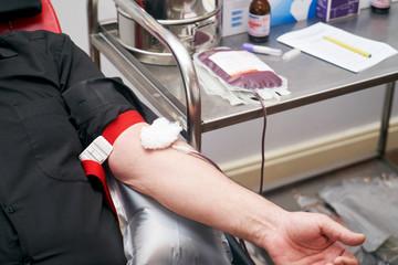 Donating blood in hospital, close-up. Blood donor