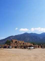 Pueblo Houses by a Mountain