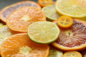 Ripe red orange lemon kumquat lime thin slices