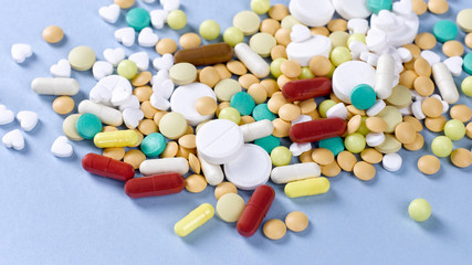 Close-up of many multi-colored pills, tablets and capsules