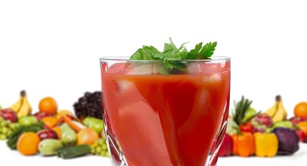 Colorful ripe vegetables and fruits and juice in a glass