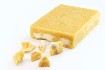 sugar candies, broken into pieces, various flavors. Brazilian rapadura, sweet from the northeast of the country. Isolated white background.