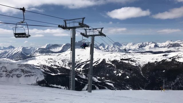 Ski Lift is Taking Skiers to The Top of The Mountain at Canadian Rocky Mountain Ski Resort. Sunshine Village, Banff, Alberta, Canada