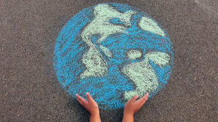 hands holding earth, chalk drawing, kid drawing, protection, environmentally friendly 