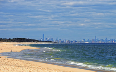 Atlantic Ocean shore at Sandy Hook with view to NYC