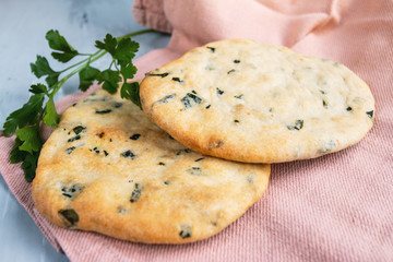 Fototapeta premium pita bread on a table top view with natural sunlight, empty space for text, traditional cuisine concept 