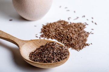Pile of cumin seeds isolated on white background