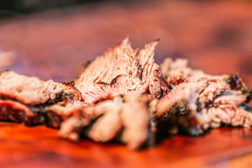 Fresh, delicious grilled meat. Grilling steak on BBQ. Close up view of grilling steak