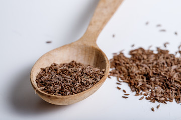 Pile of cumin seeds isolated on white background