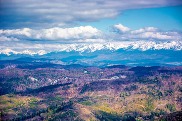 Colorful fields and rocks of Slovak Paradise national park. High Tatras in background. Slovakia