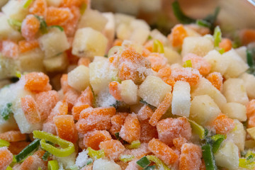 Frozen soup vegetables in a metal bowl