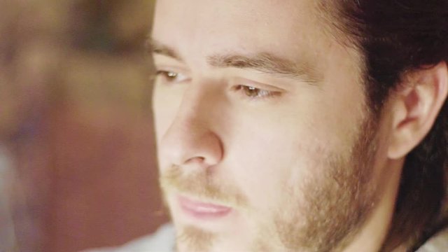 tears in the eyes of a man closeup