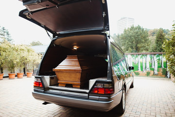 photo of a coffin car at a funeral