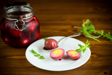 marinated chicken eggs in beetroot marinade in a plate