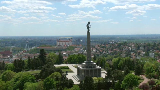 Aerial of Slavin Memorial, Bratislava Slovakia - Establishing Shot of Slavin Memorial National Cultural Monument and Military Cemetery of Soviet Soldiers, With Bratislava Castle and SNP UFO Bridge