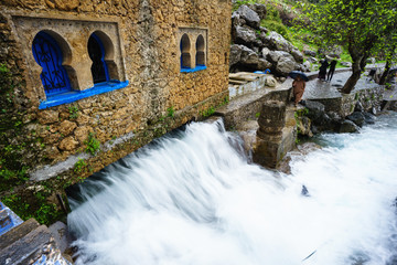 Chefchaouen, Morocco - 04/12/2018: Beautiful waterfall at the Ras Elma spring in the town of Chefchaouen in the Rif Mountains, northern Morocco.
