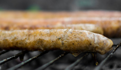 Grilled pork and beef sausages. Close up. Barbeque in nature. Delicious meat