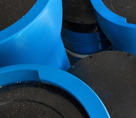 Stack of new blue pipes (tubes)