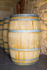 Fototapeta premium wooden barrel standing behind each other