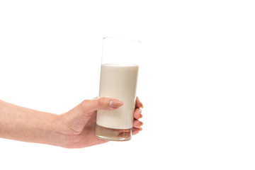 Female hand holds glass of milk isolated on white background