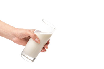 Glass of milk held by afemale hand isolated on white background