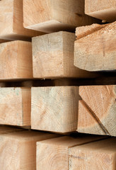 Wooden beams. Planks. Air-drying timber stack.