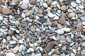 Sea pebbles. Top view. Copy space. Wallpaper for your computer and other mobile devices.