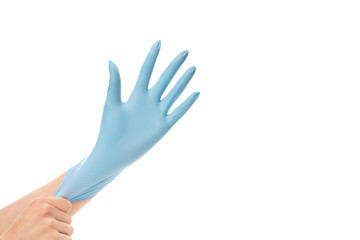 Woman wearing blue protective glove on her hand, isolated on white background