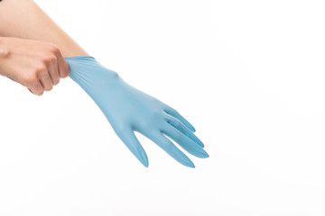 Female hand in blue glove isolated on white background