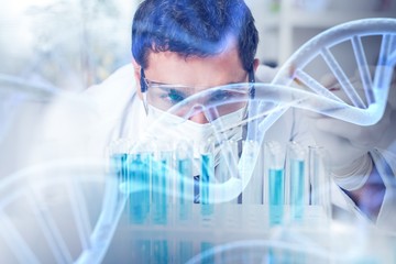 Scientist man working at the laboratory with test tubes