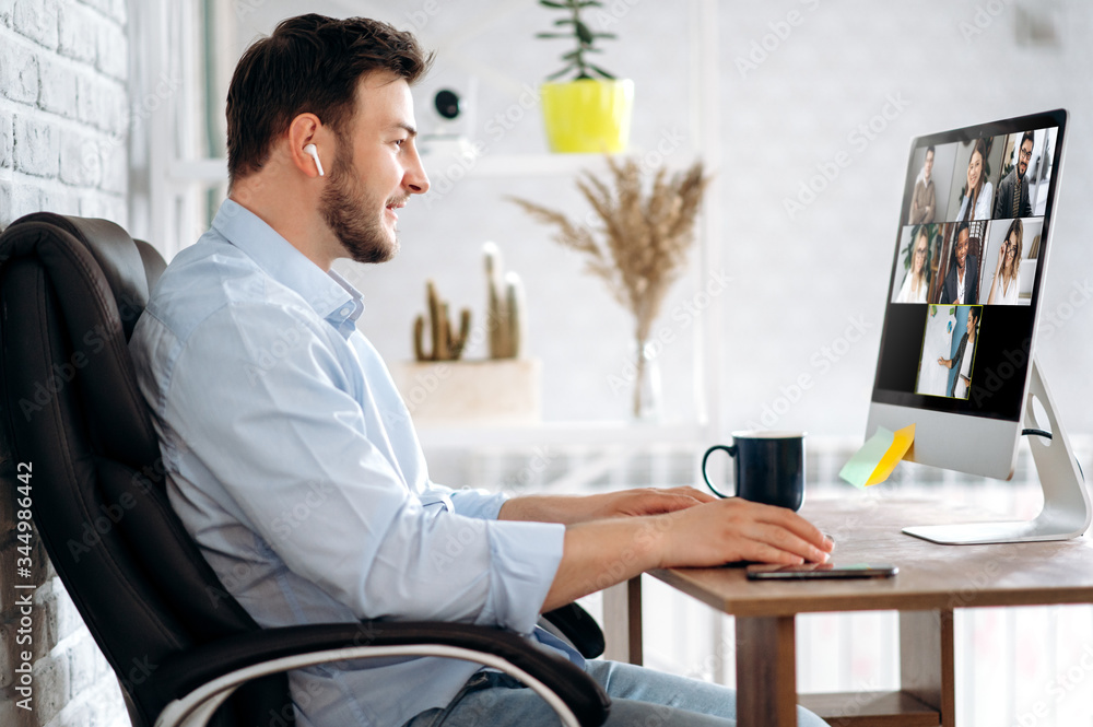 Poster business team working from home in a video conference. .the guy communicates via video call with his