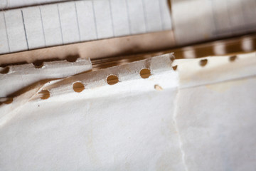 Old paper with punched holes