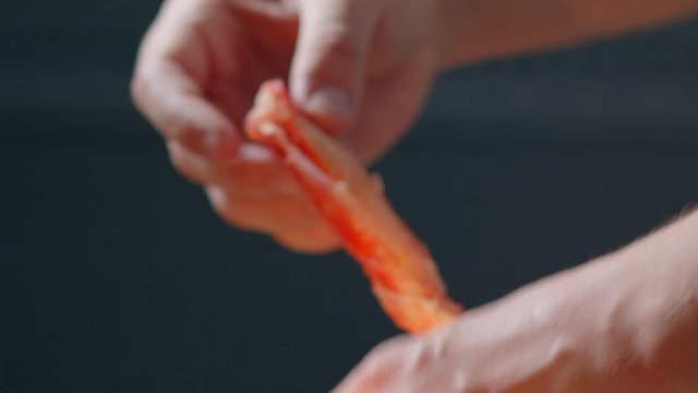 Man breaks the legs of Norwegian Red King Crab
Chef parses processed crab on a cook wooden board
cook cracking colossal Alaskan red king crab leg and ring meat
Seafood Delicacy
close-up shot 4.6K