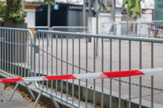 Selected focus at Red and white caution tape restrict outdoor eating area of cafe and restaurant which closed during epidemic of COVID-19 virus. COVID-19 restrictions on restaurant business in Europe.