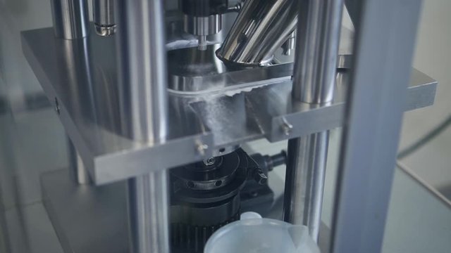Closeup testing developing automated production of white sample tablets Spbd. forming drug. shaping pills. concept pharmaceutical laboratory. quality product conveyor manufacture. coronavirus cure