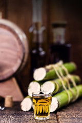 Sugar cane used for distilled beverages. Brazilian cachaça (called pinga), drip, golden rum from Brazil, details of an alembic.