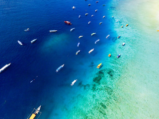 Fototapeta na wymiar Beautiful Blue Clear Water and white sand, Aerial Gili Kedis turquoise water in Lombok, Indonesia.