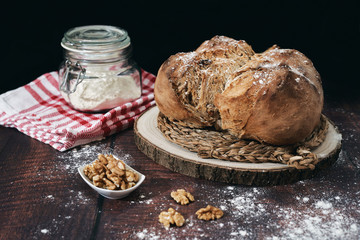 Rustic homemade bread stuffed with walnuts and baked at home in the traditional style