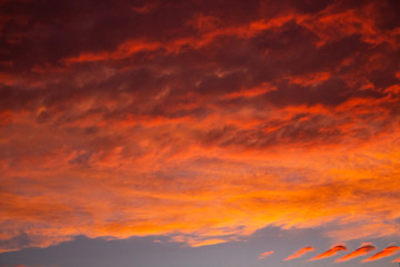 red sky with clouds