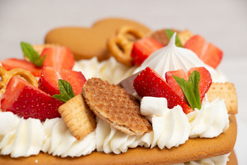 Сake heart cake with strawberries and mint