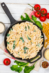 Chicken Alfredo Pasta with Spinach. Selective focus.