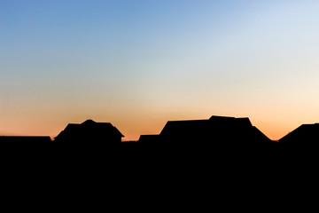 Silhouette of Houses at Sunset