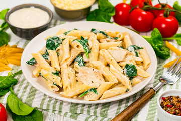 Chicken Alfredo Pasta with Spinach. Selective focus.