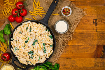 Chicken Alfredo Pasta with Spinach. Selective focus.