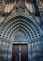 Obraz premium Main gate, facade and entrance of the Gothic Barcelona Cathedral, The Cathedral of the Holy Cross and Saint Eulalia. Barcelona, Catalonia, Spain.