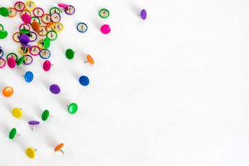 Close up of various colorful pushpins on white background with clipping path with place for text