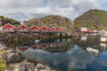 Fototapeta na wymiar typical norwegian village on the fjord. reflection in water