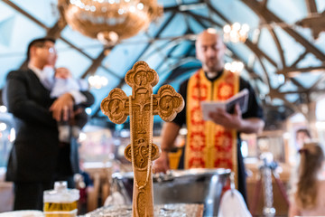 church cross people in the background blurred out